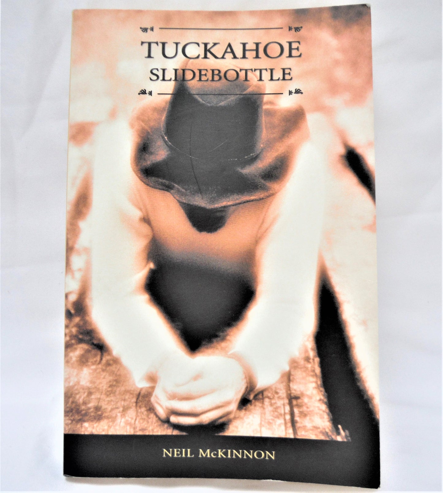 TUCKAHOE SLIDEBOTTLE, Short Stories by Neil McKinnon (1st Ed. SIGNED)