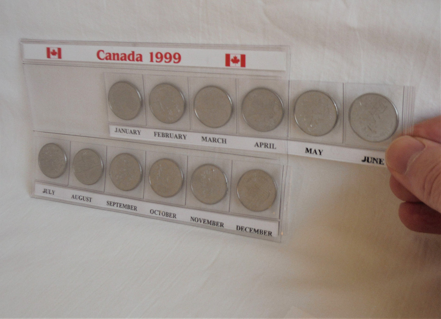 1999 Set of 12 Canadian Millennial 25-Cent Quarters, in Slide-Out Canada Display Pouch