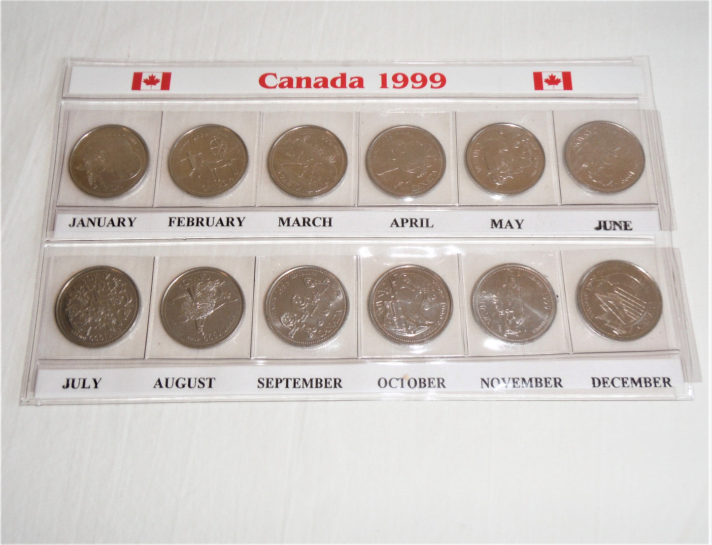 1999 Set of 12 Canadian Millennial 25-Cent Quarters, in Slide-Out Canada Display Pouch